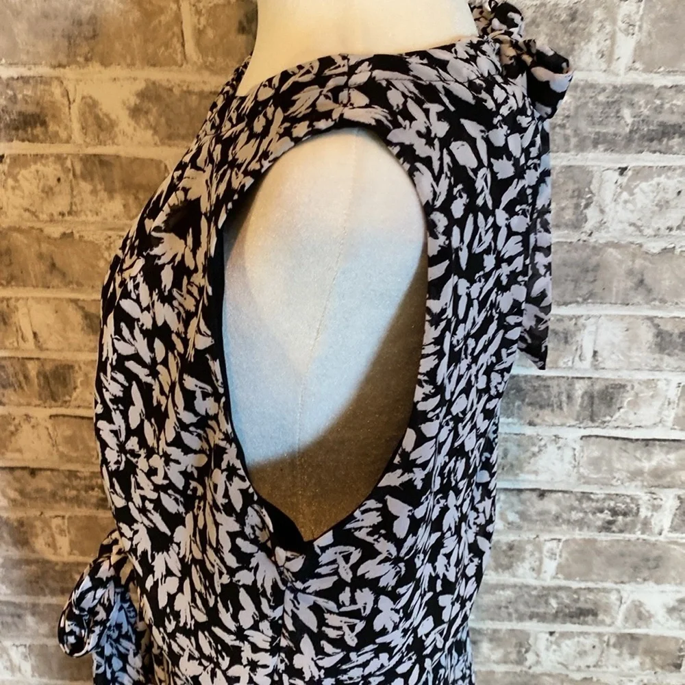 Karin Steven’s sleeveless black/white patterned lined dress. Tie at neck & waist